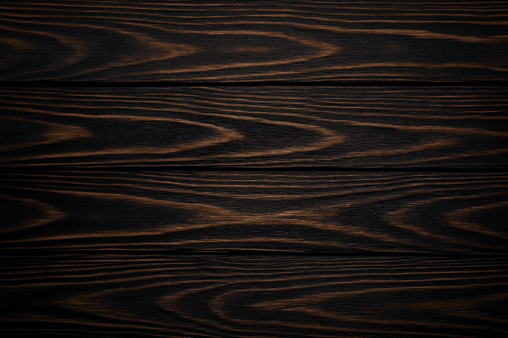 Close-up view of wenge wood showing dark brown grain with lighter streaks and natural texture